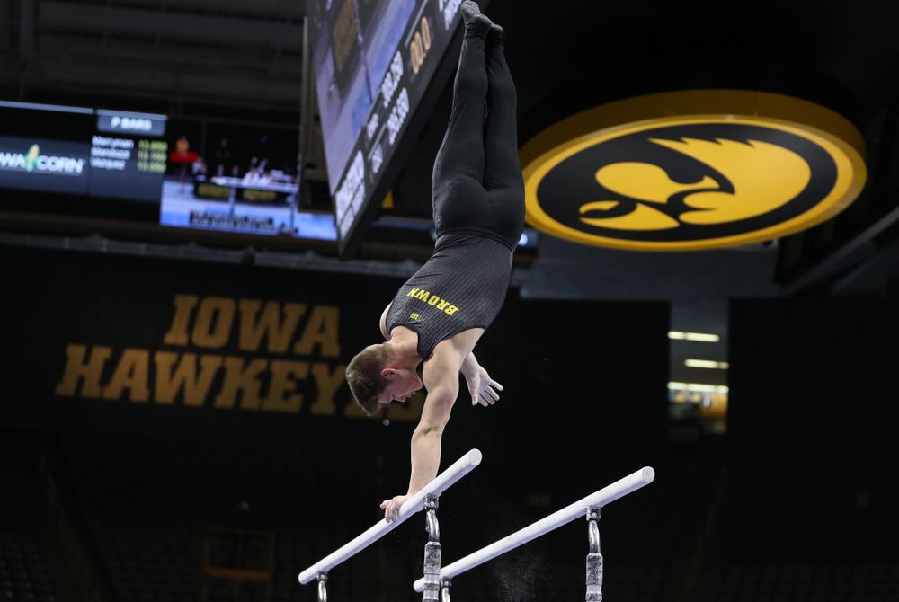 Iowa's Stewart Brown competes on the parallel bars against the Ohio State Buckeyes Saturday, March 16, 2019 at Carver-Hawkeye Arena. (Brian Ray/hawkeyesports.com)