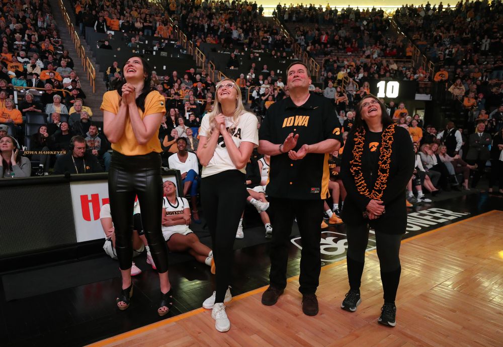 Megan Gustafson watches a video message from her teammates and coaches after her number was raised into the rafters during a jersey retirement ceremony Sunday, January 26, 2020 at Carver-Hawkeye Arena. (Brian Ray/hawkeyesports.com)