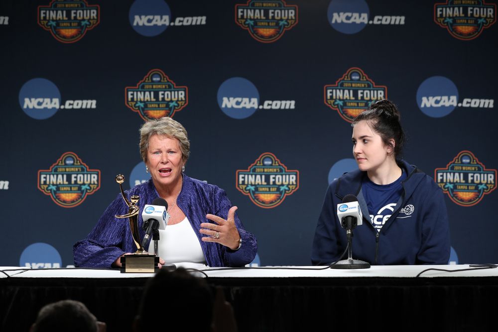 Iowa Hawkeyes forward Megan Gustafson (10) receives US Basketball Writers Association Ann Meyers Drysdale Player of the Year award from Ann Meyers Drysdale during a news conference Friday, April 5, 2019 at Amalie Arena in Tampa, FL. (Brian Ray/hawkeyesports.com)