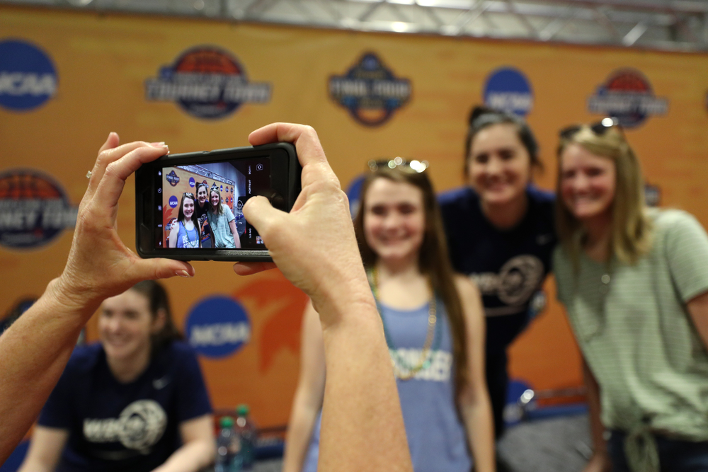 Iowa Hawkeyes forward Megan Gustafson (10) signs autographs with the other WBCA All Americans at the Tourney Town Fan Fest Friday, April 5, 2019 at the Tampa Convention Center in Tampa, FL. (Brian Ray/hawkeyesports.com)
