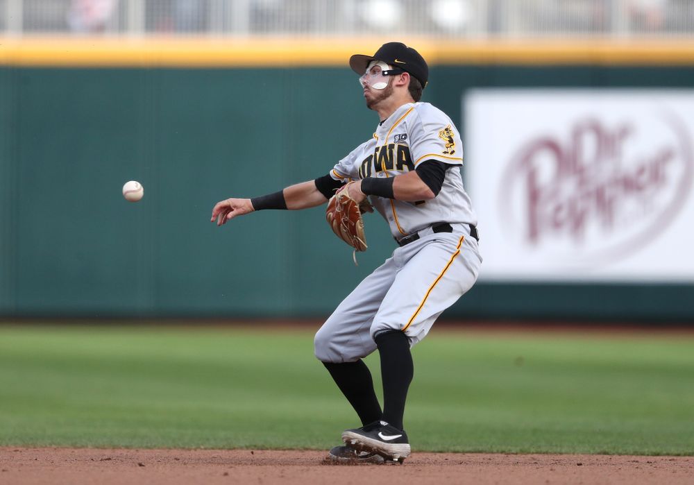 Iowa Hawkeyes infielder Mitchell Boe (4) turns a double play against the Indiana Hoosiers in the first round of the Big Ten Baseball Tournament Wednesday, May 22, 2019 at TD Ameritrade Park in Omaha, Neb. (Brian Ray/hawkeyesports.com)