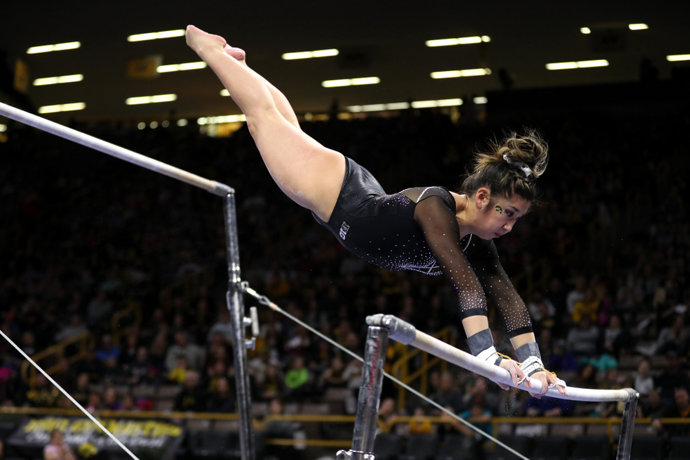 Iowa's Nicole Chow competes on the bars against Illinois Saturday, February 16, 2019 at Carver-Hawkeye Arena. (Brian Ray/hawkeyesports.com)