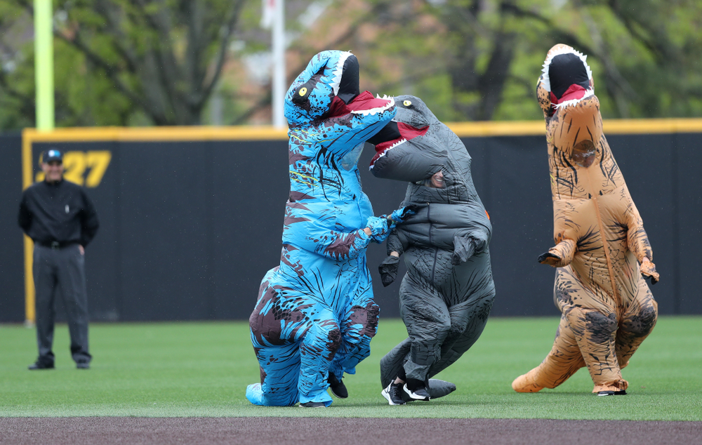 Rachel Heller, Susie Lund, and Emily run the dinosaur race during the Iowa Hawkeyes game against Michigan State Sunday, May 12, 2019 at Duane Banks Field. (Brian Ray/hawkeyesports.com)
