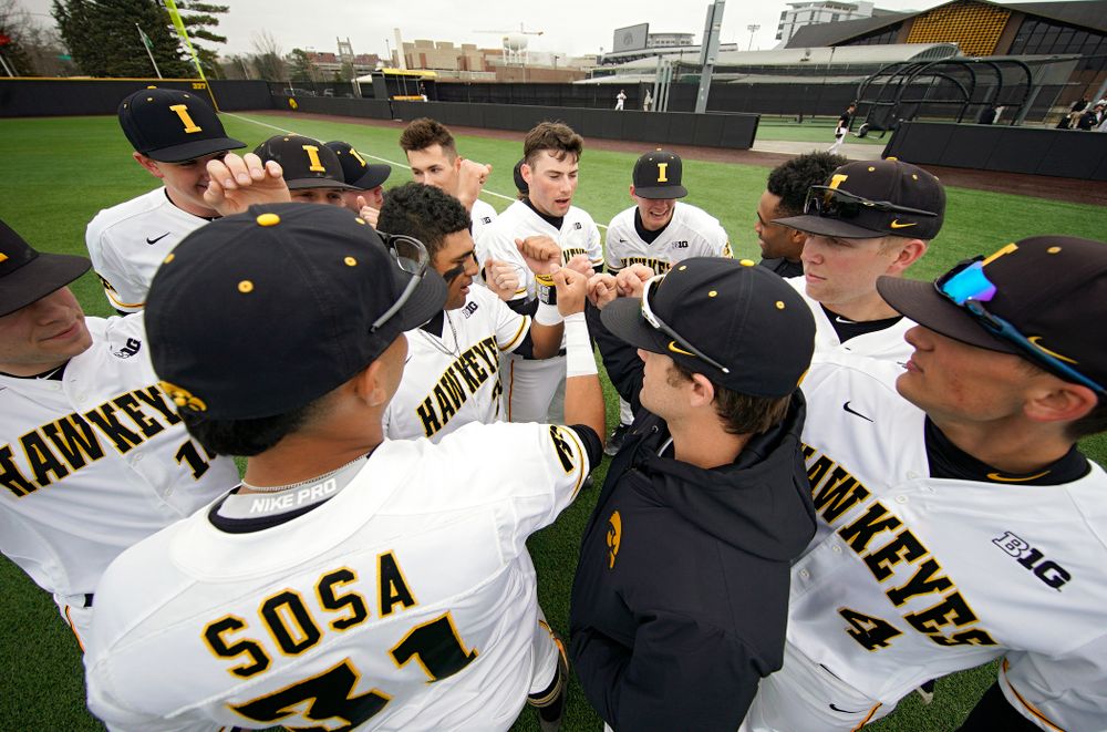 The Hawkeyes huddle before their college baseball game at Duane Banks Field in Iowa City on Wednesday, March 11, 2020. (Stephen Mally/hawkeyesports.com)