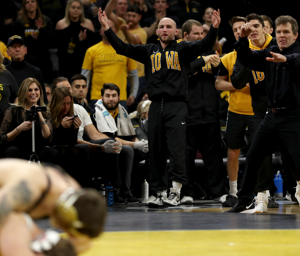 Alex Marinelli cheers as Iowa’s Abe Assad wrestles Ohio State’s Rockey Jordan at 184 pounds Friday, January 24, 2020 at Carver-Hawkeye Arena. Assad won the match 3-1. (Brian Ray/hawkeyesports.com)