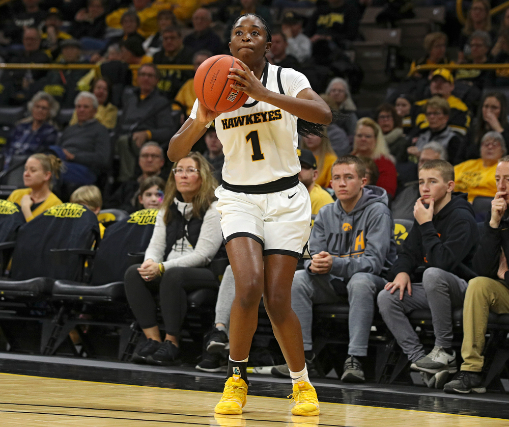 Iowa Hawkeyes guard Tomi Taiwo (1) makes a 3-pointer during the first quarter of their game at Carver-Hawkeye Arena in Iowa City on Tuesday, December 31, 2019. (Stephen Mally/hawkeyesports.com)