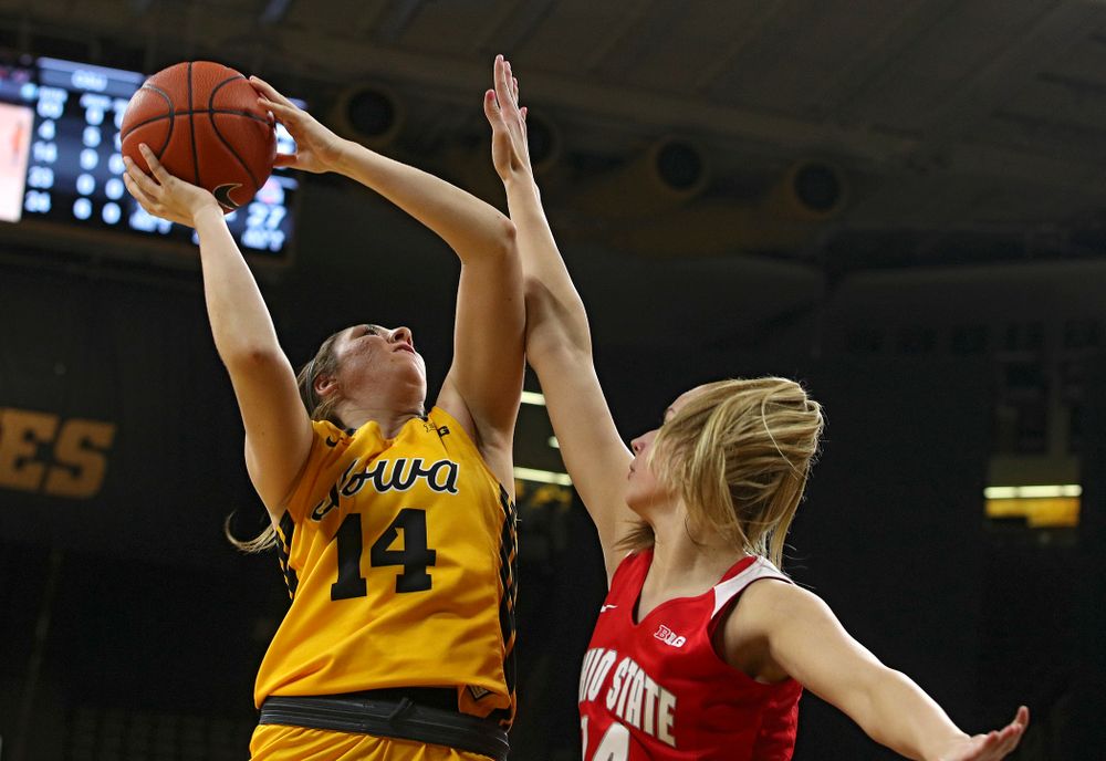 Iowa Hawkeyes guard Mckenna Warnock (14) makes a basket during the second quarter of their game at Carver-Hawkeye Arena in Iowa City on Thursday, January 23, 2020. (Stephen Mally/hawkeyesports.com)