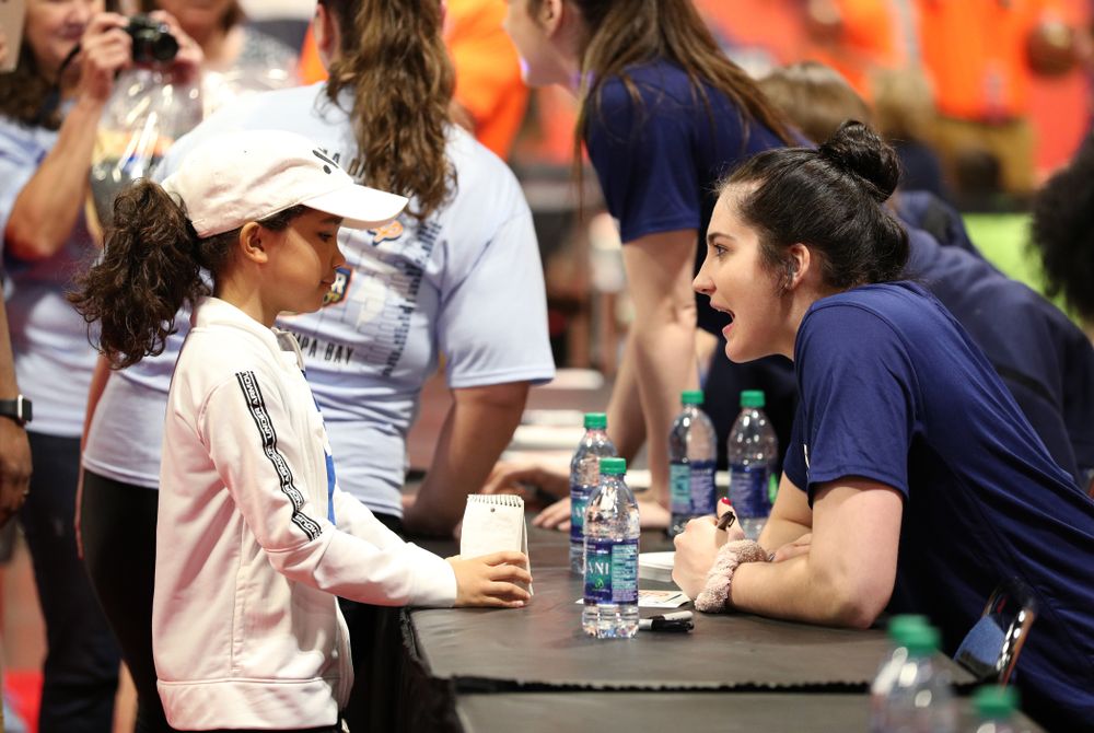 Iowa Hawkeyes forward Megan Gustafson (10) signs autographs with the other WBCA All Americans at the Tourney Town Fan Fest Friday, April 5, 2019 at the Tampa Convention Center in Tampa, FL. (Brian Ray/hawkeyesports.com)