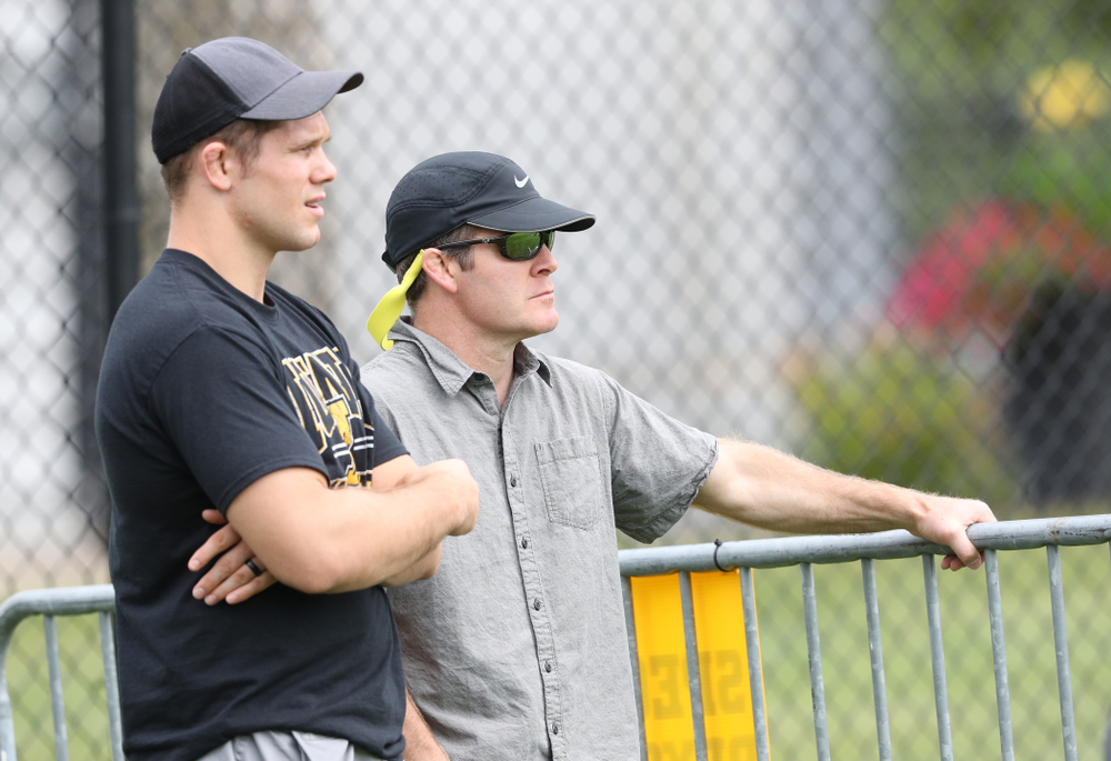 Iowa Wrestling head coach Tom Brands and former wrestler Nathan Burak watch during the Hawkeyes 6-1 win over Northern Iowa Sunday, August 25, 2019 at the Iowa Soccer Complex. (Brian Ray/hawkeyesports.com)