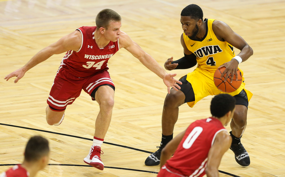 Iowa Hawkeyes guard Isaiah Moss (4) drives to the basket against Wisconsin on November 30, 2018 at Carver-Hawkeye Arena. (Tork Mason/hawkeyesports.com)