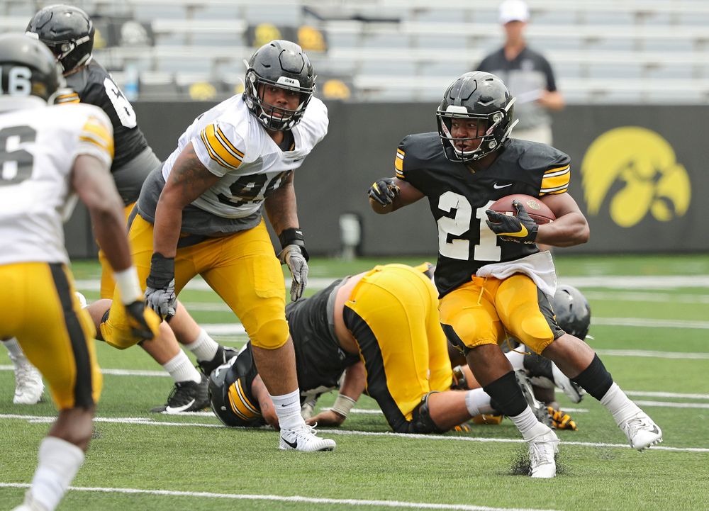 Iowa Hawkeyes running back Ivory Kelly-Martin (21) makes a cut on a run during Fall Camp Practice No. 8 at Kids Day at Kinnick Stadium in Iowa City on Saturday, Aug 10, 2019. (Stephen Mally/hawkeyesports.com)
