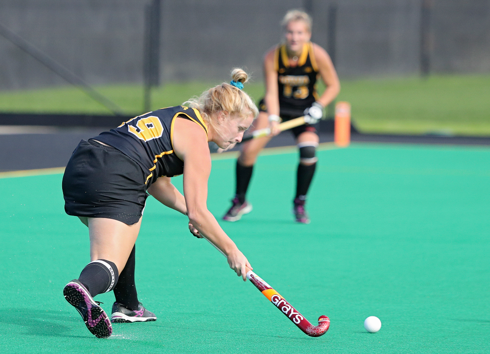 Iowa’s Ryley Miller (19) passes to Leah Zellner (13) who scored a goal during the third quarter of their match at Grant Field in Iowa City on Friday, Oct 4, 2019. (Stephen Mally/hawkeyesports.com)