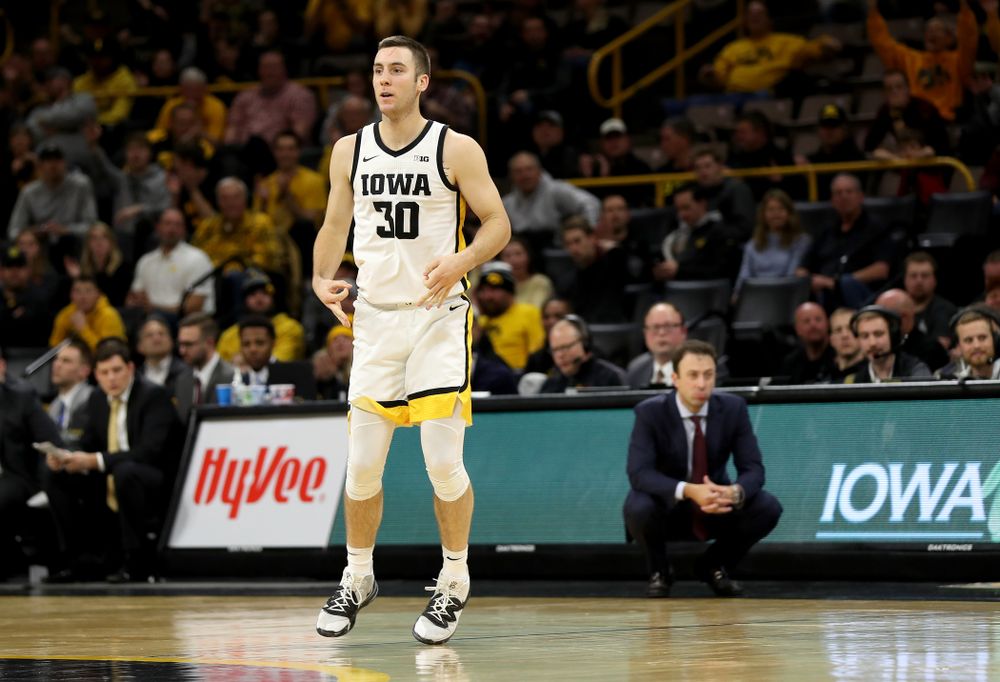 Iowa Hawkeyes guard Connor McCaffery (30) celebrates a three point basket against the Minnesota Golden Gophers Monday, December 9, 2019 at Carver-Hawkeye Arena. (Brian Ray/hawkeyesports.com)