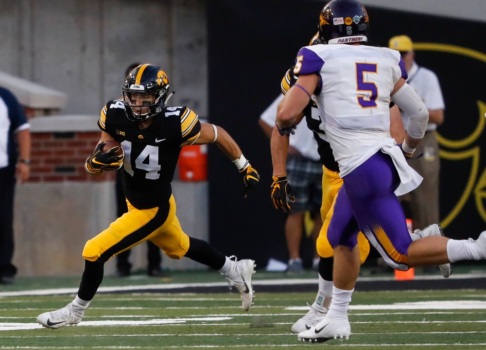Iowa Hawkeyes wide receiver Kyle Groeneweg (14) returns a punt during a game against Northern Iowa at Kinnick Stadium on September 15, 2018. (Tork Mason/hawkeyesports.com)