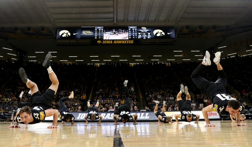Members of the Hawkeye Football team performs with the Iowa Dance Team at halftime of the Iowa Hawkeyes game against the Ohio State Buckeyes Thursday, February 20, 2020 at Carver-Hawkeye Arena. (Brian Ray/hawkeyesports.com)