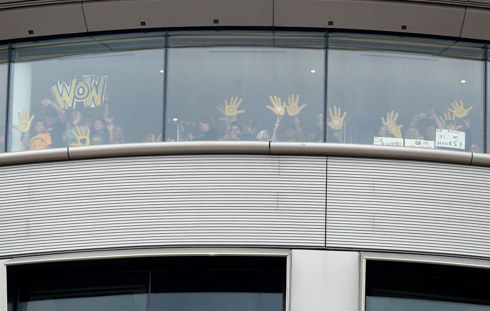 People in the University of Iowa Stead Family Children's Hospital wave back between the first and second quarter of their game at Kinnick Stadium in Iowa City on Saturday, Sep 28, 2019. (Stephen Mally/hawkeyesports.com)