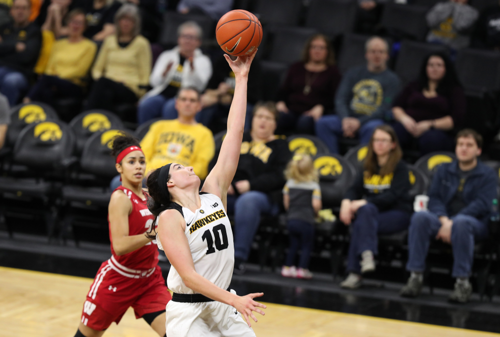 Iowa Hawkeyes forward Megan Gustafson (10) pulls down a pass against the Wisconsin Badgers Monday, January 7, 2019 at Carver-Hawkeye Arena. (Brian Ray/hawkeyesports.com)