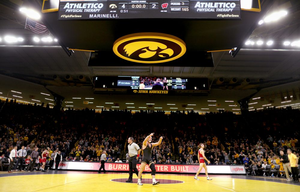 IowaÕs Alex Marinelli celebrates after defeating WisconsinÕs Evan Wick at 165 pounds Sunday, December 1, 2019 at Carver-Hawkeye Arena. Marinelli won the match 4-2. (Brian Ray/hawkeyesports.com)
