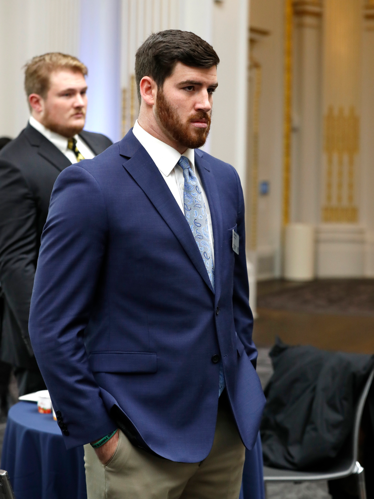 Iowa Hawkeyes linebacker Josey Jewell (43), defensive back Joshua Jackson (15), offensive lineman Sean Welsh (79) and head coach Kirk Ferentz ring the opening bell at the New York Stock Exchange Tuesday, December 26, 2017 in New York. (Brian Ray/hawkeyesports.com)