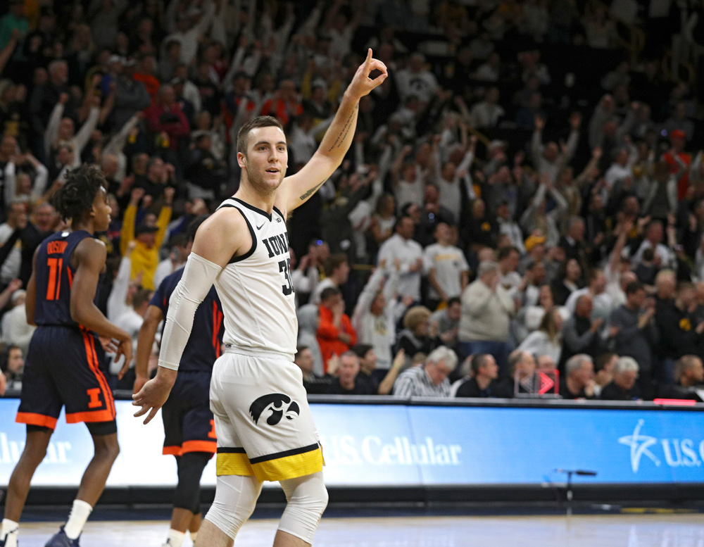 Iowa Hawkeyes guard Connor McCaffery (30) celebrates after an assist on a dunk by guard Joe Wieskamp (not pictured) during the second half of the game at Carver-Hawkeye Arena in Iowa City on Sunday, February 2, 2020. (Stephen Mally/hawkeyesports.com)