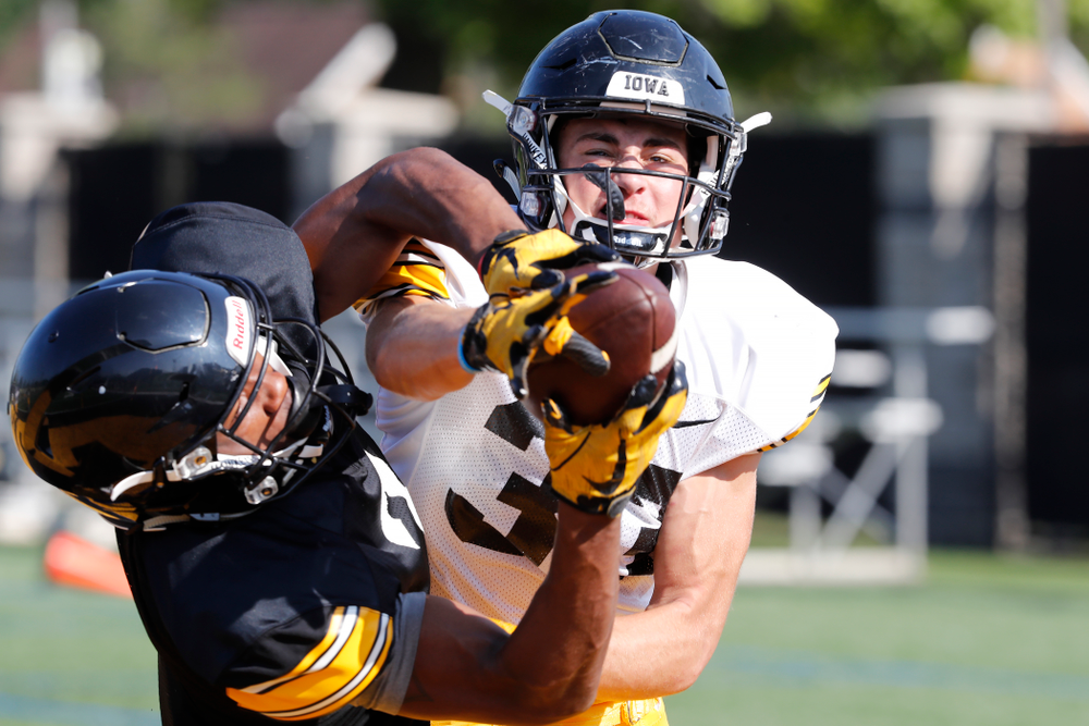 Iowa Hawkeyes defensive back Riley Moss (33) and wide receiver Tyrone Tracy Jr. (3) during camp practice No. 17 Wednesday, August 22, 2018 at the Kenyon Football Practice Facility. (Brian Ray/hawkeyesports.com)