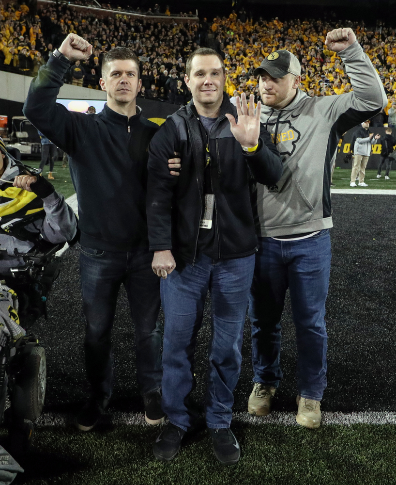 Former Hawkeyes Joe Conklin, Brett Greenwood, and Pat Angerer are recognized with the rest of the 2009 team during the Iowa Hawkeyes game against the Penn State Nittany Lions Saturday, October 12, 2019 at Kinnick Stadium. (Brian Ray/hawkeyesports.com)