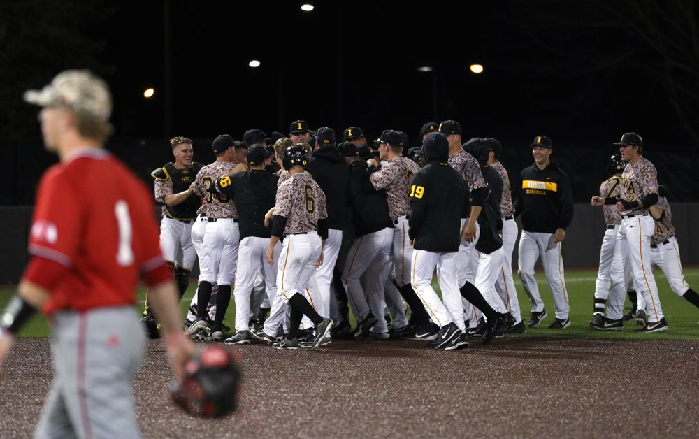 The Iowa Hawkeyes celebrate their walk off win against the Nebraska Cornhuskers on Military Appreciation Night Friday, April 19, 2019 at Duane Banks Field. (Brian Ray/hawkeyesports.com)