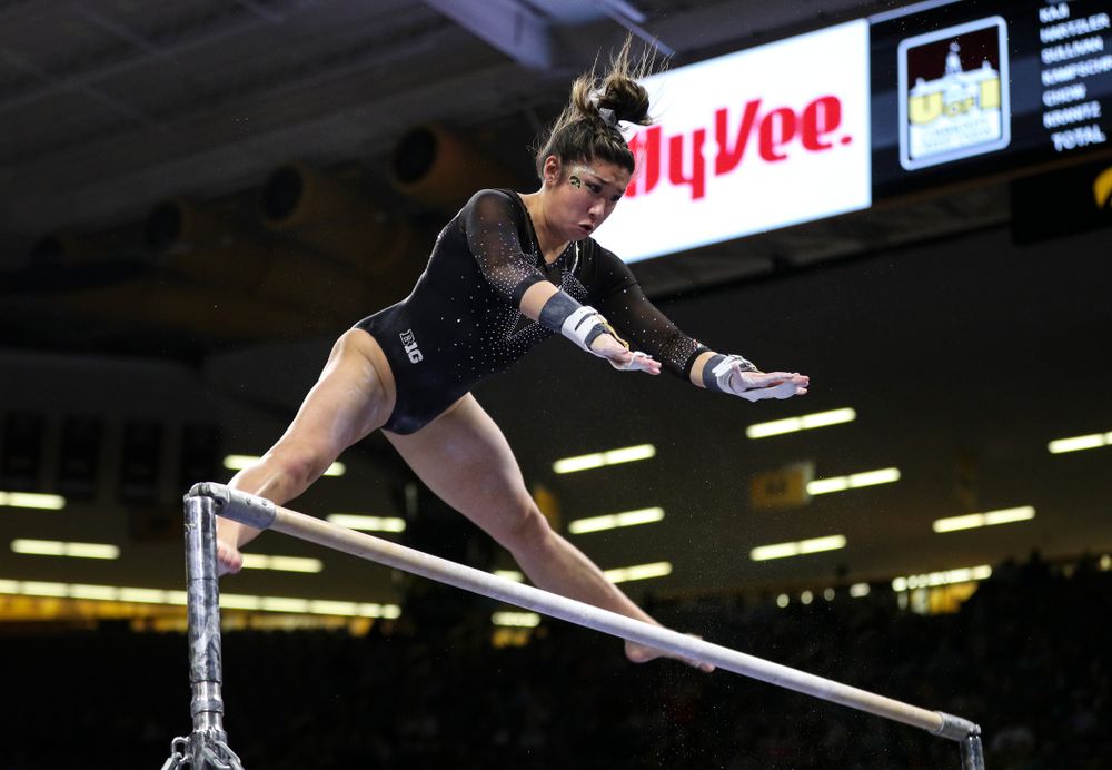 Iowa's Nicole Chow competes on the bars against Illinois Saturday, February 16, 2019 at Carver-Hawkeye Arena. (Brian Ray/hawkeyesports.com)