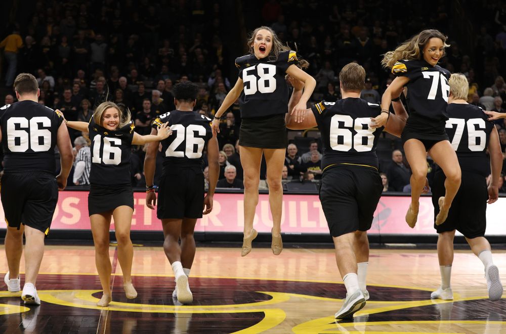 The Iowa Dance Team performs with the Iowa Football Team at halftime of the Iowa Hawkeyes game against the Indiana Hoosiers Friday, February 22, 2019 at Carver-Hawkeye Arena. (Brian Ray/hawkeyesports.com)