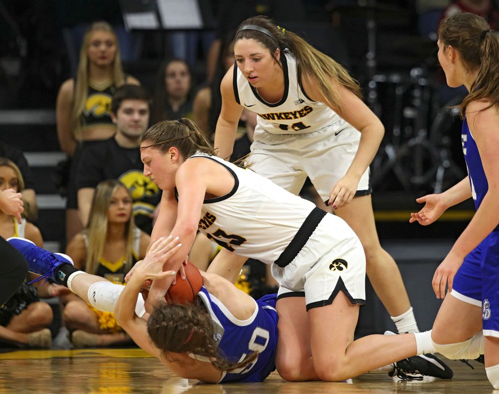 Iowa Hawkeyes forward Amanda Ollinger (43) hangs on to a tie ball during the third quarter of their game at Carver-Hawkeye Arena in Iowa City on Saturday, December 21, 2019. (Stephen Mally/hawkeyesports.com)