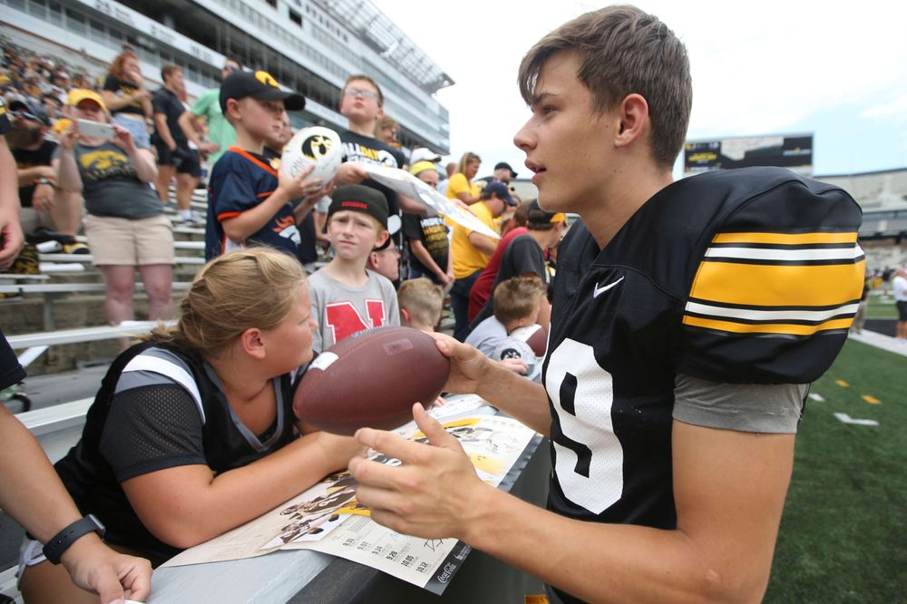 Iowa Hawkeyes wide receiver Jackson Ritter (29) signs autographs during Kids Day at Kinnick Stadium on Saturday, August 10, 2019. (Lily Smith/hawkeyesports.com)