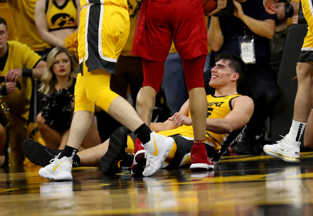 Iowa Hawkeyes forward Luka Garza (55) smiles after drawing a charging foul against the Rutgers Scarlet Knights Wednesday, January 22, 2020 at Carver-Hawkeye Arena. (Brian Ray/hawkeyesports.com)