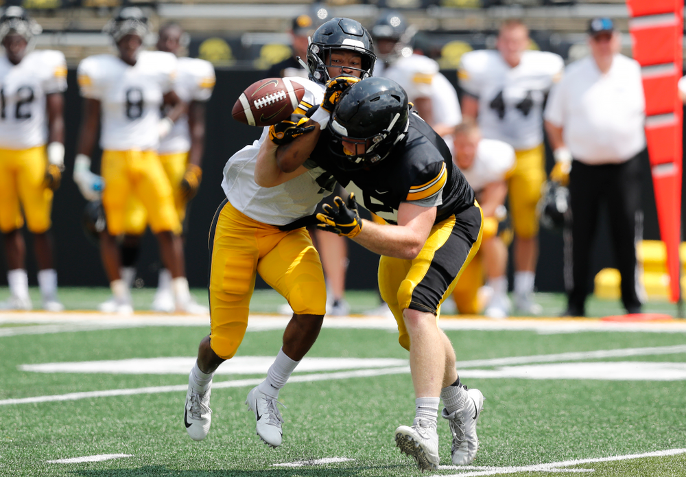 Iowa Hawkeyes tight end Shaun Beyer (42) and defensive back Josh Turner (4) during Kids Day Saturday, August 11, 2018 at Kinnick Stadium. (Brian Ray/hawkeyesports.com)