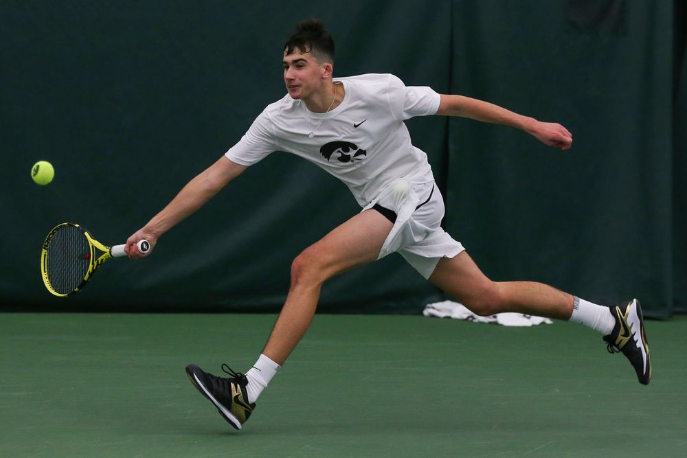 Iowa’s Matt Clegg dives for a forehand during the Iowa men’s tennis match vs Western Michigan on Saturday, January 18, 2020 at the Hawkeye Tennis and Recreation Complex. (Lily Smith/hawkeyesports.com)