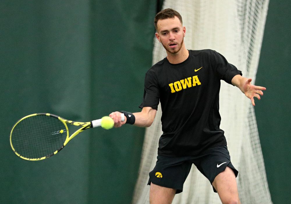 Iowa’s Kareem Allaf returns a shot during his singles match at the Hawkeye Tennis and Recreation Complex in Iowa City on Friday, February 14, 2020. (Stephen Mally/hawkeyesports.com)