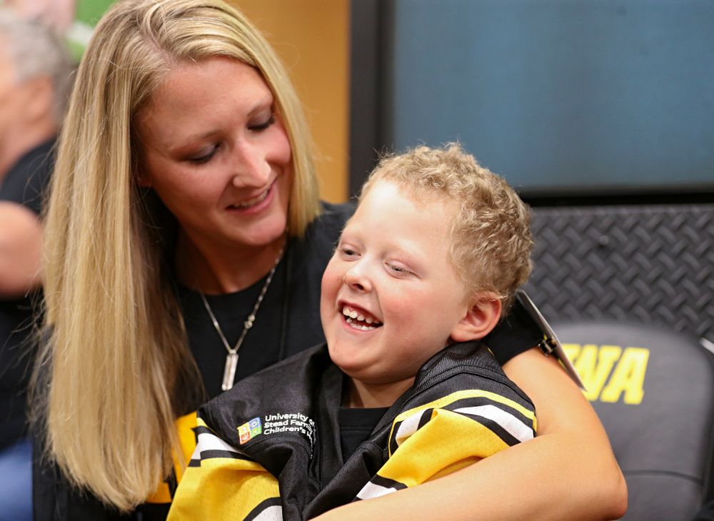 Kid Captain Cooper Leeman is all smiles in the Iowa locker room during Kids Day at Kinnick Stadium in Iowa City on Saturday, Aug 10, 2019. (Stephen Mally/hawkeyesports.com)