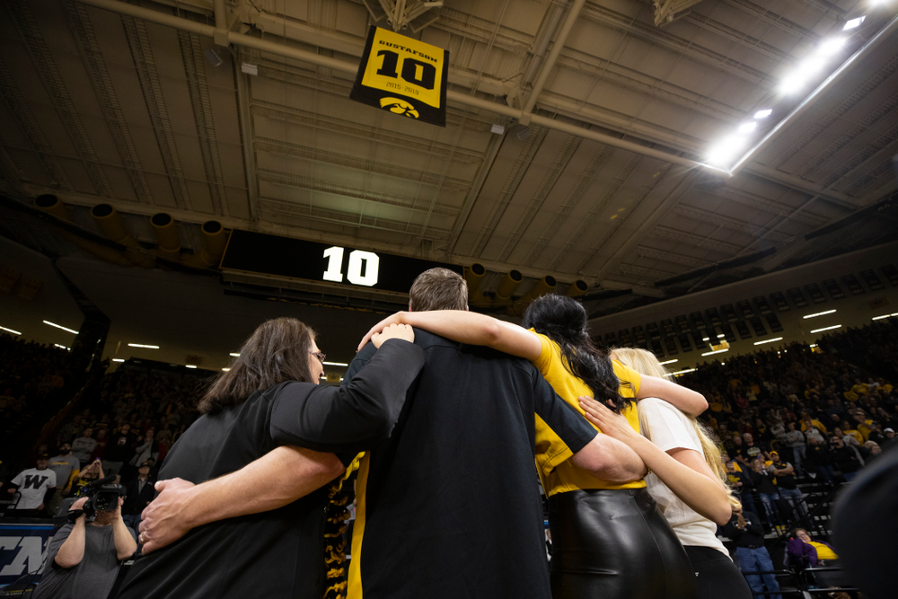 Megan Gustafson stands with her family as her number is raised into the rafters during a jersey retirement ceremony Sunday, January 26, 2020 at Carver-Hawkeye Arena. (Brian Ray/hawkeyesports.com)