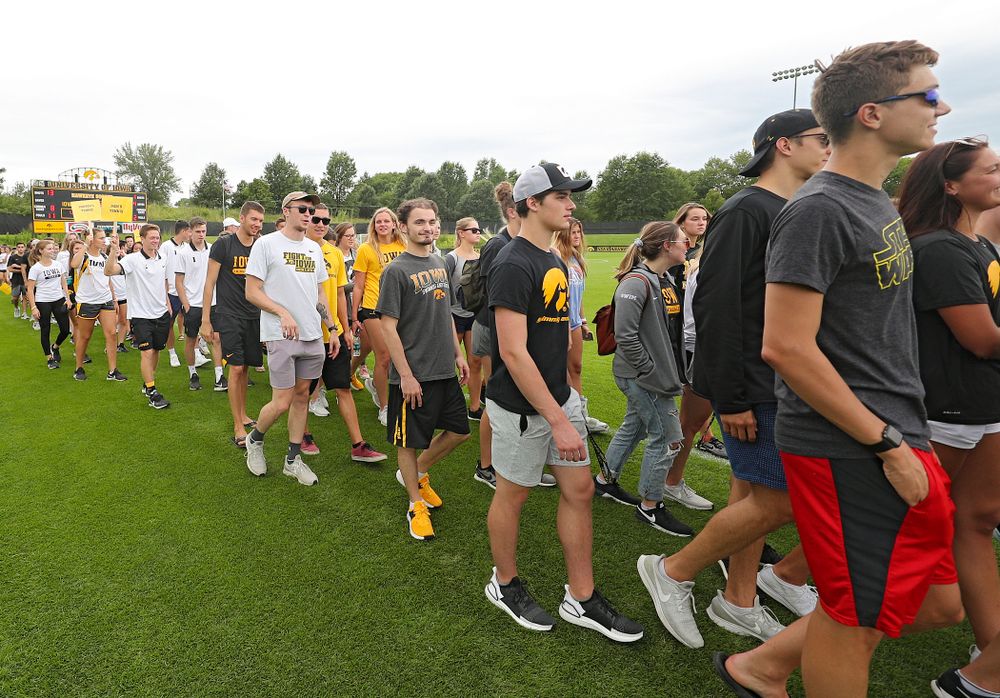 Student-athletes walk in the Parade of Champions during the Student-Athlete Kickoff at the Iowa Soccer Complex in Iowa City on Sunday, Aug 25, 2019. (Stephen Mally/hawkeyesports.com)