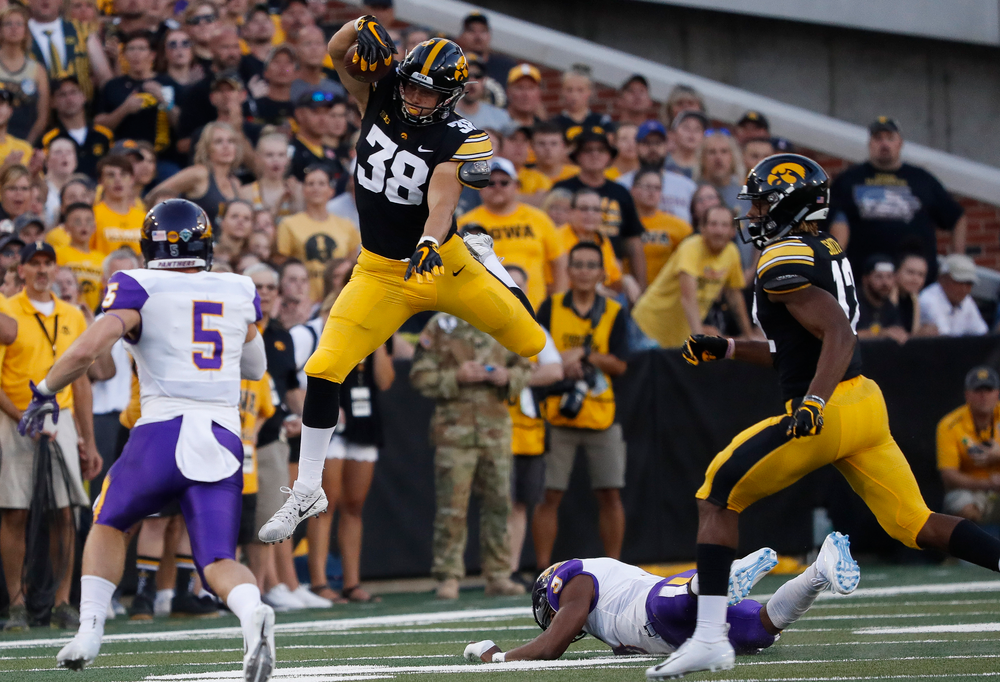 Iowa Hawkeyes tight end T.J. Hockenson (38) hurdles a defender during a game against Northern Iowa at Kinnick Stadium on September 15, 2018. (Tork Mason/hawkeyesports.com)