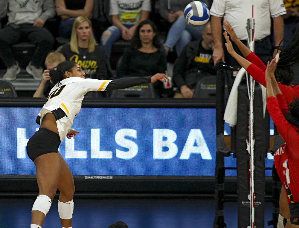 Iowa’s Griere Hughes (10) sends a kill over during the first set of their match at Carver-Hawkeye Arena in Iowa City on Saturday, Nov 30, 2019. (Stephen Mally/hawkeyesports.com)