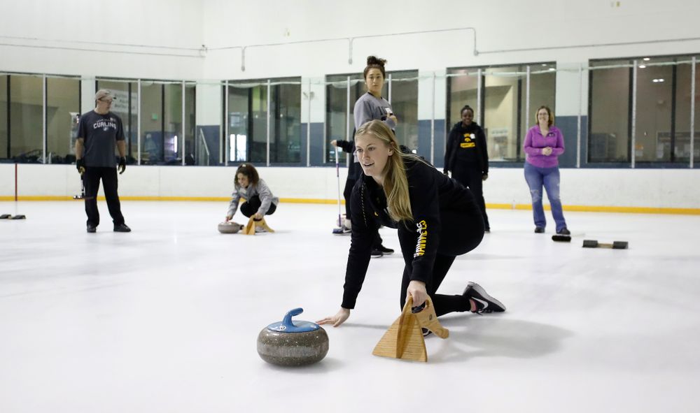 Members of the Iowa Softball team learn the sport of curling as part of a team building event Wednesday, January 10, 2018 at the Cedar Rapids Ice Arena. (Brian Ray/hawkeyesports.com)