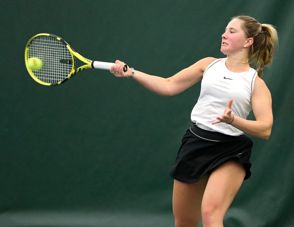 Iowa’s Danielle Burich returns a shot during her singles match at the Hawkeye Tennis and Recreation Complex in Iowa City on Sunday, February 16, 2020. (Stephen Mally/hawkeyesports.com)