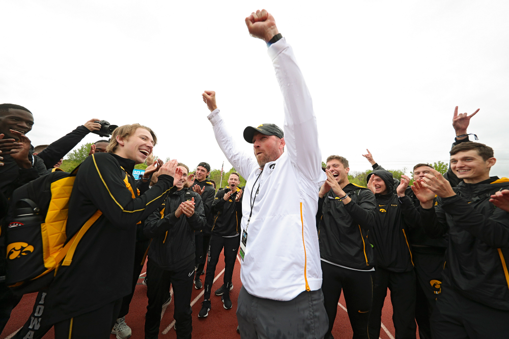 Iowa Director of Track and Field Joey Woody celebrates with his team after winning the Men's Big Ten Outdoor Track and Field Championships on the third day of the Big Ten Outdoor Track and Field Championships at Francis X. Cretzmeyer Track in Iowa City on Sunday, May. 12, 2019. (Stephen Mally/hawkeyesports.com)