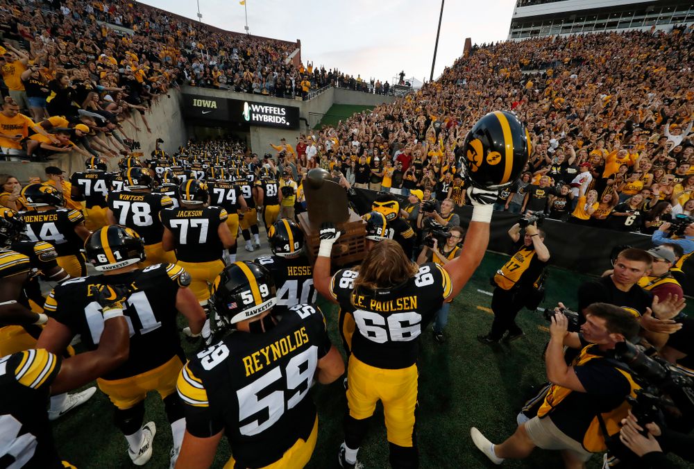 The Iowa Hawkeyes celebrate with the Cy-Hawk trophy following their game against the Iowa State Cyclones Saturday, September 8, 2018 at Kinnick Stadium. (Brian Ray/hawkeyesports.com)