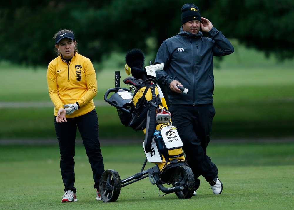 Iowa's Manuela Lizarazu gets instruction from Iowa assistant coach Michael Roters during the Diane Thomason Invitational at Finkbine Golf Course on September 29, 2018. (Tork Mason/hawkeyesports.com)