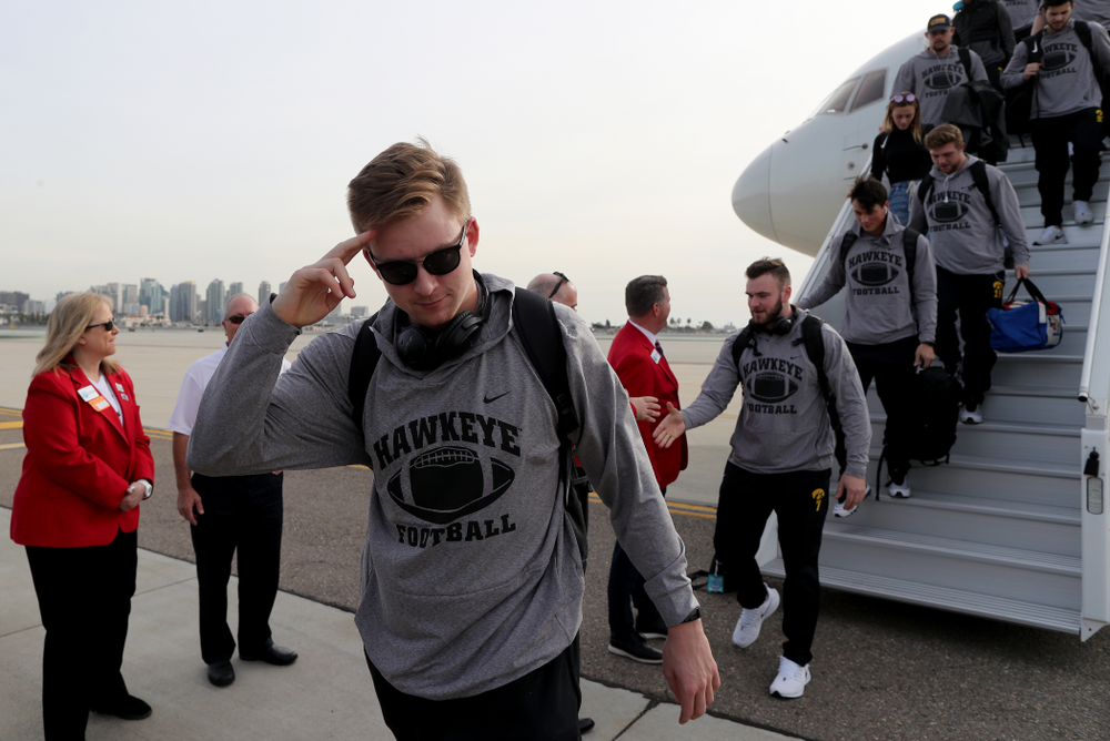 Iowa Hawkeyes quarterback Spencer Petras (7) solutes after arriving in San Diego, CA Saturday, December 21, 2019 for the Holiday Bowl. (Brian Ray/hawkeyesports.com)