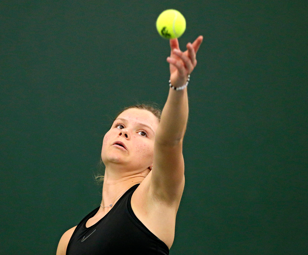 Iowa's Cloe Ruette serves the ball during their doubles match against Indiana at the Hawkeye Tennis and Recreation Complex in Iowa City on Sunday, Mar. 31, 2019. (Stephen Mally/hawkeyesports.com)