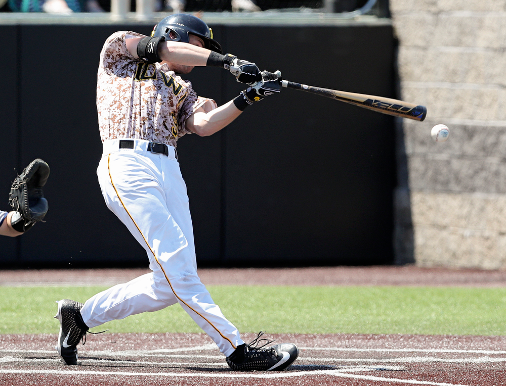 Iowa Hawkeyes center fielder Ben Norman (9) hits an RBI double during the first inning of their game against UC Irvine at Duane Banks Field in Iowa City on Sunday, May. 5, 2019. (Stephen Mally/hawkeyesports.com)