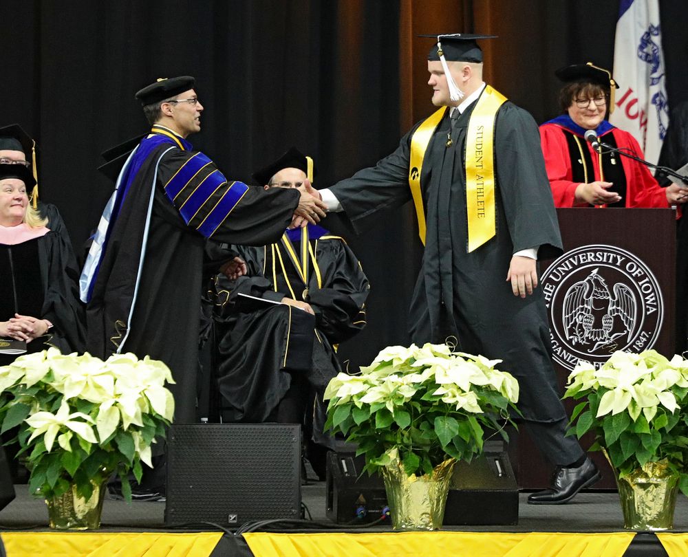 Iowa offensive lineman Spencer Williams during the College of Liberal Arts and Sciences and University College Fall 2019 Commencement ceremony at Carver-Hawkeye Arena in Iowa City on Saturday, December 21, 2019. (Stephen Mally/hawkeyesports.com)
