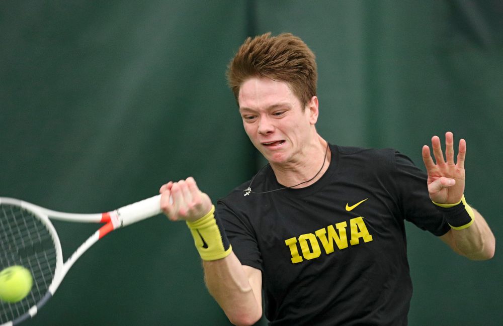 Iowa’s Jason Kerst hits a shot during his match against Marquette at the Hawkeye Tennis and Recreation Complex in Iowa City on Saturday, January 25, 2020. (Stephen Mally/hawkeyesports.com)